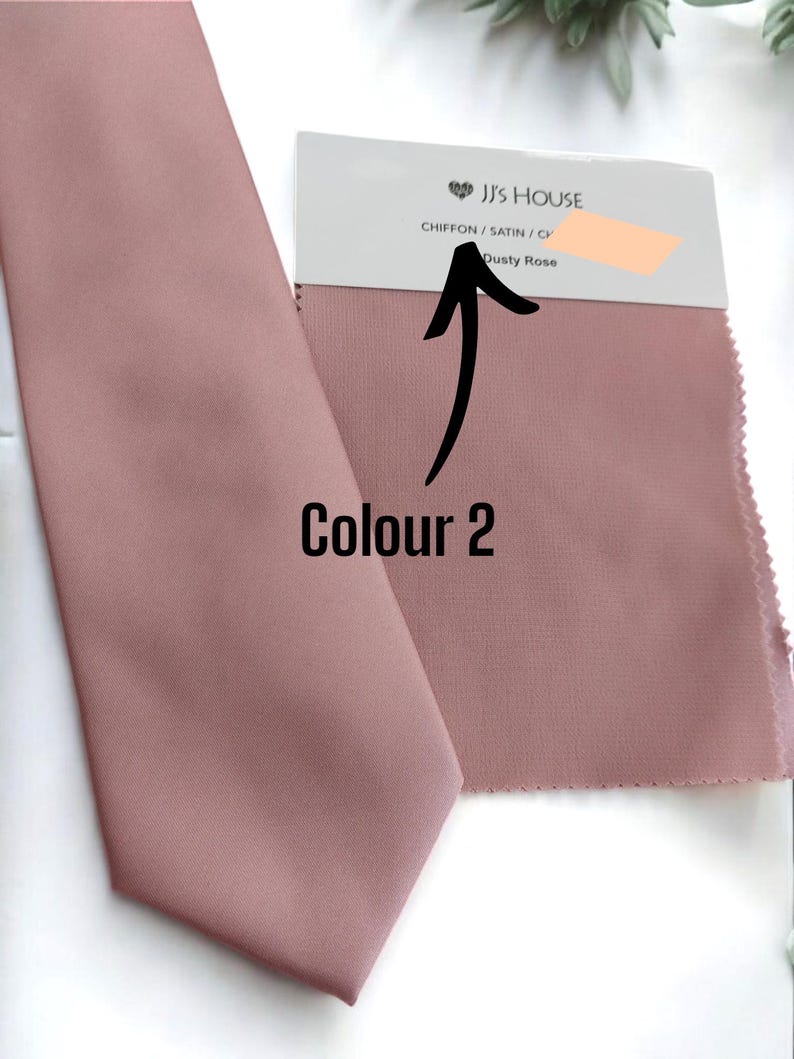 May include: A dusty rose colored tie made of chiffon and satin fabric. The tie is shown next to a fabric swatch with the text "JJ's House Chiffon / Satin / Chiffon Dusty Rose".