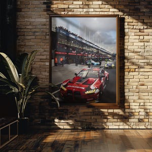 May include: A framed print of a race car on a track. The red car has black accents and sponsor logos. The track has other cars and spectators. The print is hanging on a brick wall with a window and a plant.