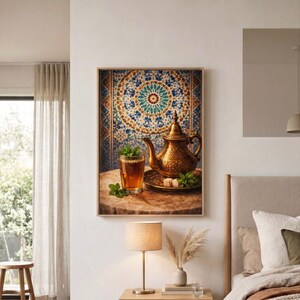 May include: A framed wall art print featuring a golden metal teapot and a glass of amber tea with fresh mint leaves and sugar cubes. The background displays a detailed blue, gold, and white geometric tile pattern, creating a vibrant visual.