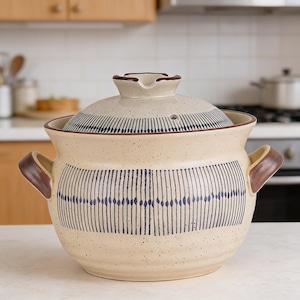 May include: A rustic wooden sign with the text "Welcome to our home" in white lettering. The sign features a distressed finish and a simple, inviting design, perfect for front door decor.