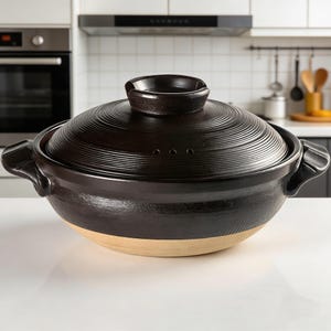 Stor svart keramisk Donabe-gryta, japansk lergryta för soppa och ris, modern hantverksköksgåva