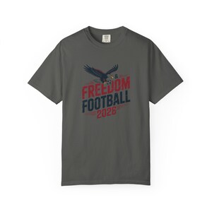 Charcoal t-shirt with "Freedom & Football 2026" and eagle graphic.