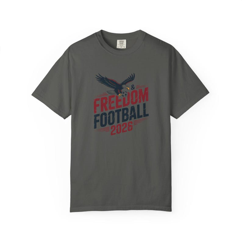 Charcoal t-shirt with "Freedom & Football 2026" and eagle graphic.