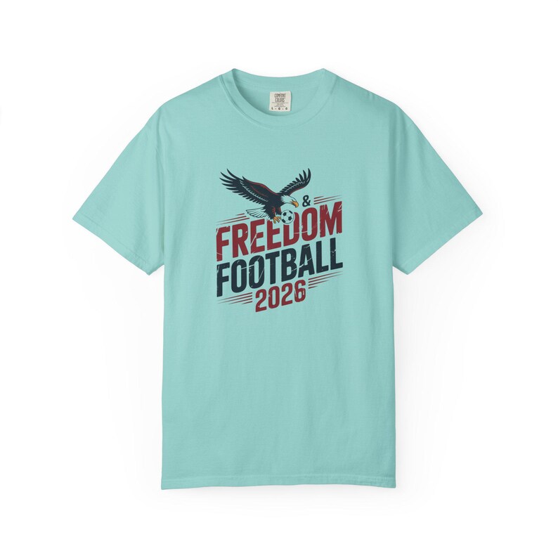 T-shirt with eagle, "Freedom Football 2026" text and soccer ball.