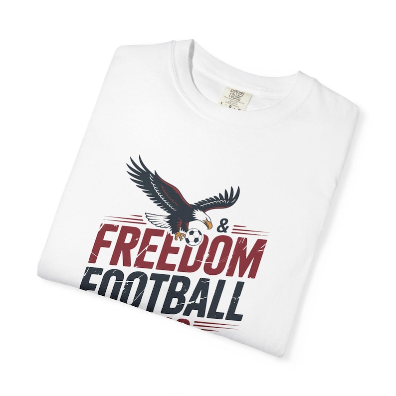 White t-shirt with eagle and text FREEDOM FOOTBALL.