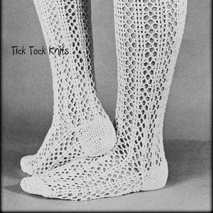 May include: A pair of white crocheted knee-high socks with a lacy pattern. The socks are shown on a pair of legs. The text "Tick Tock Knits" is visible on the image.