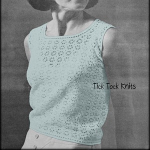 May include: A sleeveless crocheted top with a delicate floral pattern in a light blue color. The top has a round neckline and is shown on a model. The text "Tick Tock Knits" is visible in the bottom right corner of the image.