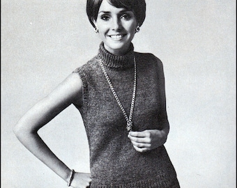 May include: A black and white photo of a woman wearing a sleeveless knitted top and skirt. The top has a turtleneck and the skirt has pleats. The woman is wearing a necklace with a pendant.