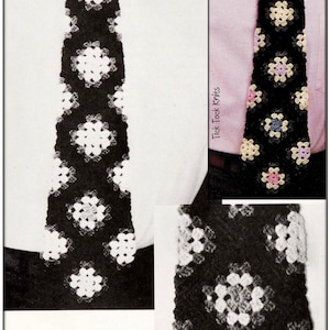 May include: Black and white crocheted tie with a floral pattern. The tie features a repeating design of white flowers on a black background. The text "Tick Tock Knits" is visible at the bottom of the image.
