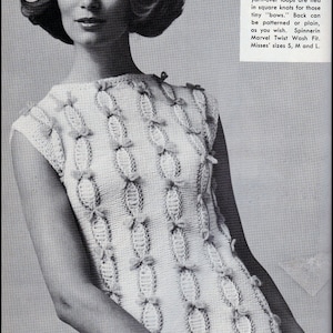 May include: A white knitted sleeveless top with a bow-tie detail. The top is knitted in a stockinette stitch and has a fitted silhouette. The text "TICK TOCK KNITS" is printed at the bottom of the image.