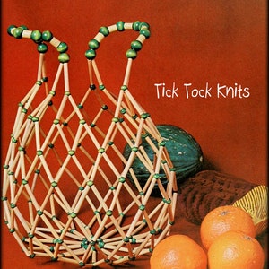 May include: A handcrafted basket made from wooden dowels, with green beads at the handles and intersections. The basket is displayed with three oranges and a green melon against a reddish-brown background. The text "Tick Tock Knits" is visible.