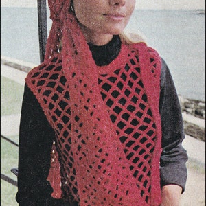 May include: A red crocheted scarf and hat set. The scarf is a loose, open weave with a fringe at the bottom. The hat is a close-fitting beanie style.