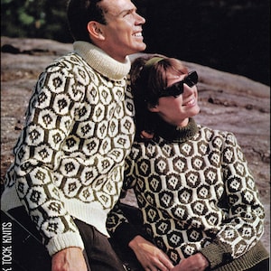 May include: A couple wearing matching white and green patterned sweaters with a geometric design. The sweaters have a turtleneck style.