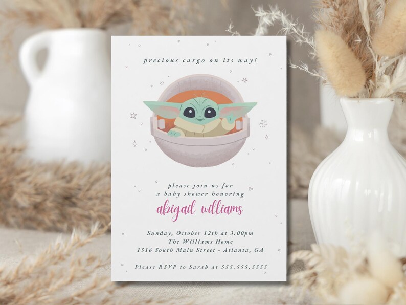 May include: Baby shower invitation featuring a cartoon character in a pod. The invitation text reads "precious cargo on its way!" and invites guests to celebrate Abigail Williams. The event is on October 12th at 3:00 PM.