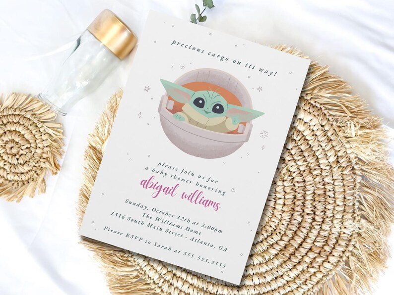 May include: Baby shower invitation featuring a cartoon character in a pod, with the text "precious cargo on its way!". The invitation includes details for a baby shower honoring Abigail Williams, with the date, time, and location.