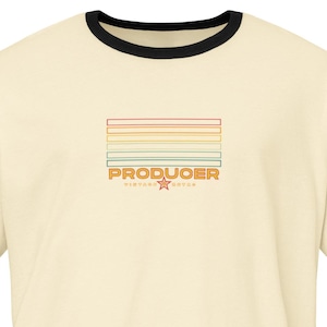 May include: Cream-coloured ringer t-shirt with black trim. The shirt features a rectangular design with horizontal stripes in various colours and the word "PRODUOER" in orange, along with a star and text below.