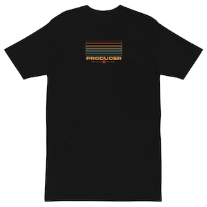 May include: Black t-shirt featuring a horizontal striped design in red, orange, yellow, and green. The word "PRODUCER" is printed in orange, with additional text below. A minimalist design.