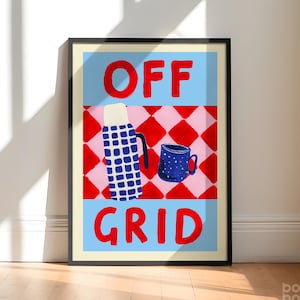 May include: Framed art print with the words "OFF GRID" in red block letters. The artwork features a blue and white thermos, a blue mug with white dots, and a red and pink checkered pattern on a light blue background.
