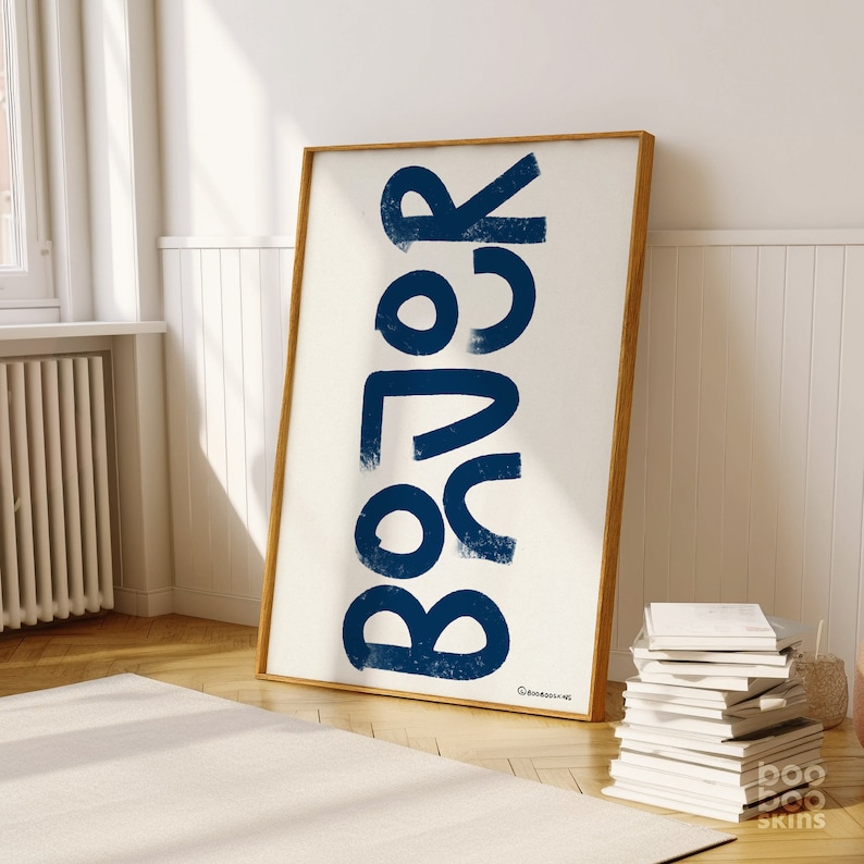 May include: A framed print featuring the word "COLOR" in large, bold, blue lettering on a white background.