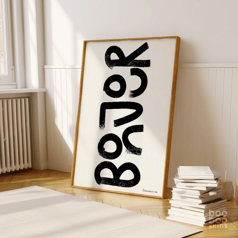May include: Black and white abstract art print with the word "Relax" written in large, bold letters. The print is framed in a natural wood frame.