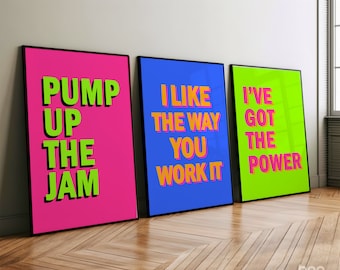 May include: Three framed prints with motivational quotes in bright colors. The first print is pink with green text that reads "Pump Up The Jam". The second print is blue with orange text that reads "I Like The Way You Work It". The third print is green with orange text that reads "I've Got The Power".