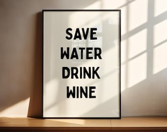 May include: A black framed poster with a white background and black text that reads "Save Water Drink Wine".
