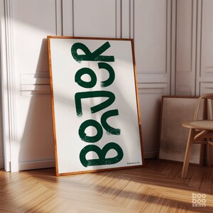 May include: A framed print featuring the word "Boho" in a stylised, green font against a white background.