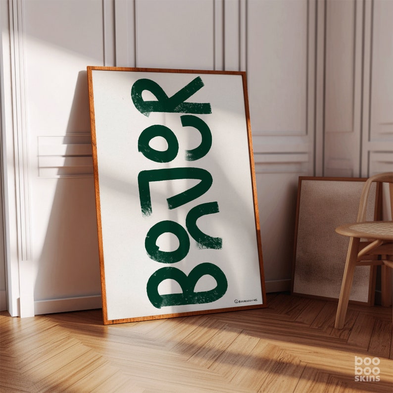 May include: A framed print featuring the word "Boho" in a stylised, green font against a white background.