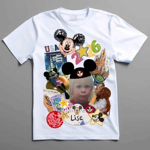 Op de afbeelding: Een wit t-shirt met korte mouwen voorzien van een collage met Disney-thema, waaronder een Mickey Mouse-ballon, het Walt Disney World-logo, een kind met Mickey-oren en de naam Lise op een centraal ovaal embleem met sterren.