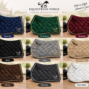 May include: A collection of nine quilted saddle pads from Equestrian Forge in royal blue, forest green, burgundy, black, grey, pearl ginger, brown, charcoal, and pearl white. Each pad features a diamond pattern, gold or silver trim, and logo.