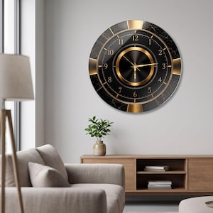 May include: A circular wall clock featuring a black marble-patterned face with gold-toned accents. The clock has a central gold ring, thin gold hands, and gold numerals from one to twelve arranged in a circular pattern against a dark background.