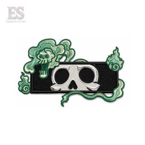 May include: An embroidered patch featuring a rectangular black border containing a white skull with large dark eye sockets. The design is surrounded by swirling light green smoke-like patterns and a smaller skull integrated into the top left smoke.