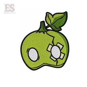 May include: An embroidered patch featuring a light green apple with a single dark green leaf on top. The apple has two large white circular eyes and a beige adhesive bandage placed over the left eye, with black outlines defining the shape.