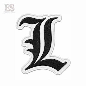 May include: An embroidered patch featuring the letter L in a black gothic font style. The letter has a thick white border and a white inner outline, creating a layered appearance. The design is clean and sharp, with dense black stitching.