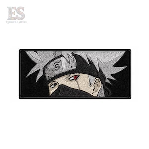 May include: A rectangular embroidered patch featuring a close-up of a character with spiky silver hair, a black forehead protector with a spiral symbol, and a black face mask. The character has one visible eye with a red iris and black markings.