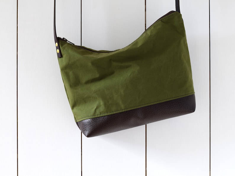 waxed canvas crossbody bag minimal design adjustable leather strap leather base image 7