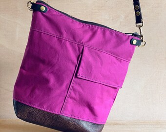 Small Crossbody sling bag in Berry pink dry wax canvas. Womens shoulder handbag with front pocket and adjustable long leather across strap