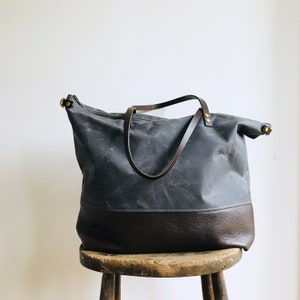 Waxed canvas large tote bag. Stylish minimal work, gym, weekend bag. Spacious holdall large enough for laptop. Grey wax canvas with pockets.