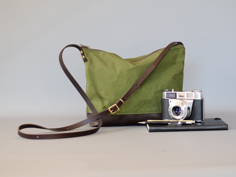 waxed canvas crossbody bag minimal design adjustable leather strap leather base image 8