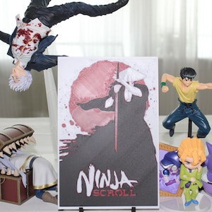 May include: A collection of anime-style figurines including a character in a dark suit with red markings, a character in a yellow shirt, a character in a green suit, a purple creature, and a mimic chest, alongside a rectangular Ninja Scroll print.