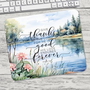 May include: A watercolor painting of a lake with trees and flowers. The text "Give thanks to the Lord for he is good his love endures forever Psalm 107:1" is written on the image.
