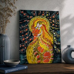 May include: Abstract canvas art depicting a figure with a yellow halo and flowing hair. The painting uses yellow, orange, and red hues against a dark teal backdrop, with scattered white and orange dots.
