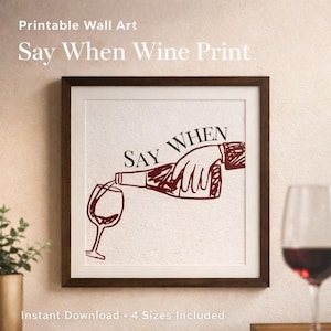 May include: Printable wall art in a dark brown frame. The artwork features a wine bottle pouring into a glass, with the words "Say When" above the illustration. The image is a digital download.