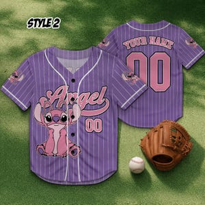 May include: A purple baseball jersey with white pinstripes, displaying the word "Angel" and the number "00" in pink, alongside a cartoon character. A baseball glove and ball are also visible.