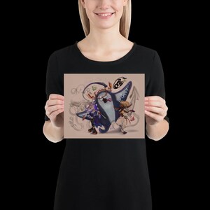 May include: A rectangular art print featuring a central illustration of a large blue manta ray character with a wide mouth, flanked by two smaller stylised figures. The background is a light tan colour with faint, swirling line art sketches.