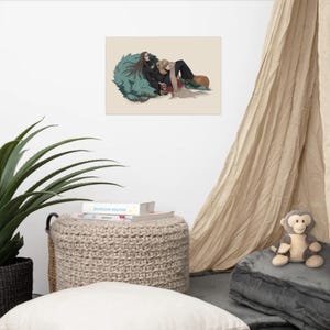 May include: A rectangular art print featuring a digital illustration of a long-haired person in black clothing resting against a large, teal, furry creature. Beside them, a person with long blonde hair wears a brown hat and dark trousers.