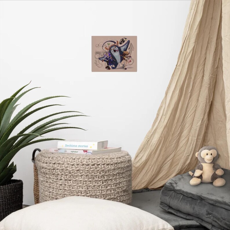 May include: A rectangular wall art print featuring a stylised illustration of a dark blue manta ray character with white markings, accompanied by a smaller light-coloured figure, set against a light tan background with faint line art details.