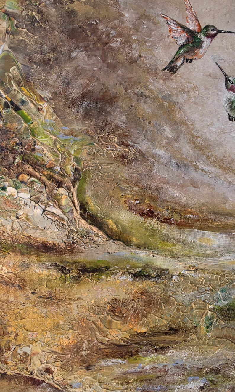 May include: An oil painting on canvas featuring two hummingbirds in flight against a textured, abstract background. The birds display vibrant green, white, and reddish-orange plumage. The surface shows thick, layered brushstrokes in earthy tones.
