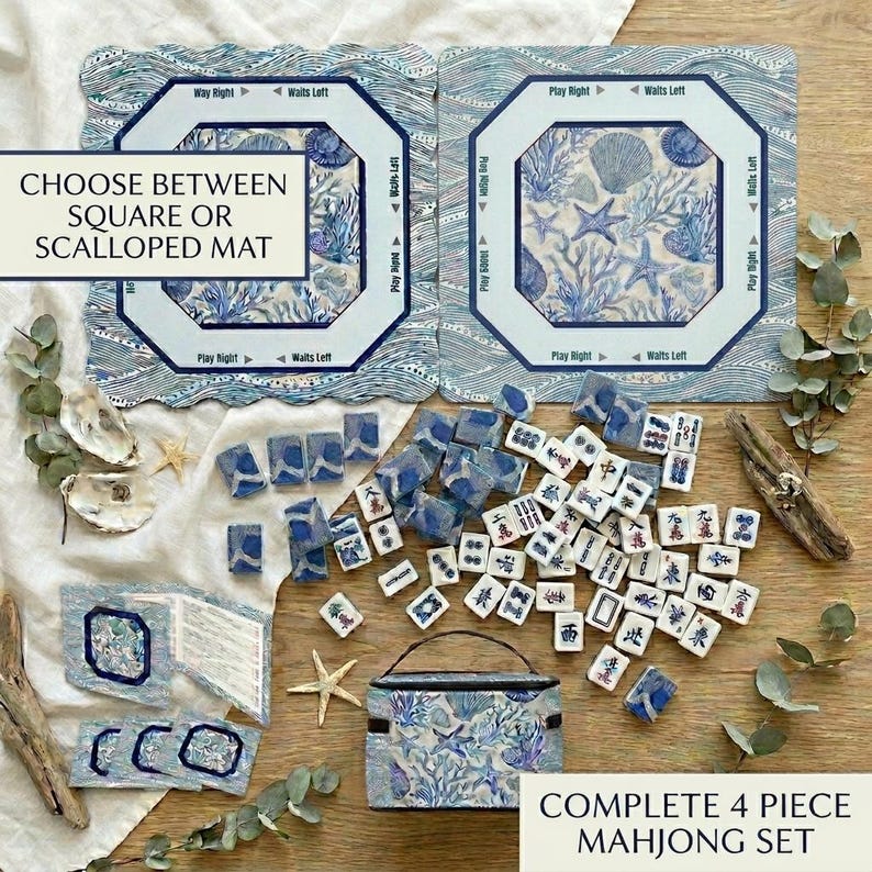 Complete 4-piece American mahjong gift set in blue and white ocean print — includes choice of square or scalloped mahjong mat with rules, custom-back mahjong tiles, acrylic card holders, and a zippered tile bag in coordinating coral and shell design. A stunning mahjong gift for 50th or 80th birthdays.