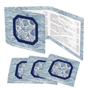 Acrylic mahjong card holder with line finder alongside a blue and white shell-print mahjong card sleeve — a mahjong card cover designed for NMJL American mahjong cards. Part of the fully coordinated blue and white coastal mahjong gift bundle.